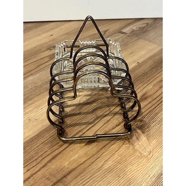 Vintage silver-plated toast rack with an attached glass butter or jam dish, manufactured in England by Fales of Sheffield....