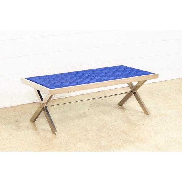 This vintage mid century modern Milo Baughman style chrome and blue strap bench is circa 1980. The clean, minimalist...