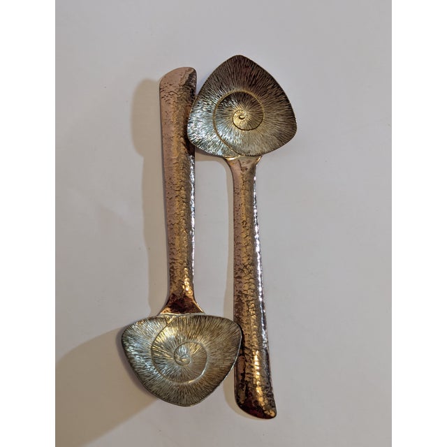 Rare and superb studio metalwork from Emilia Castillo, stamped and dated October 1985. Nautilis detail on serving spoons...