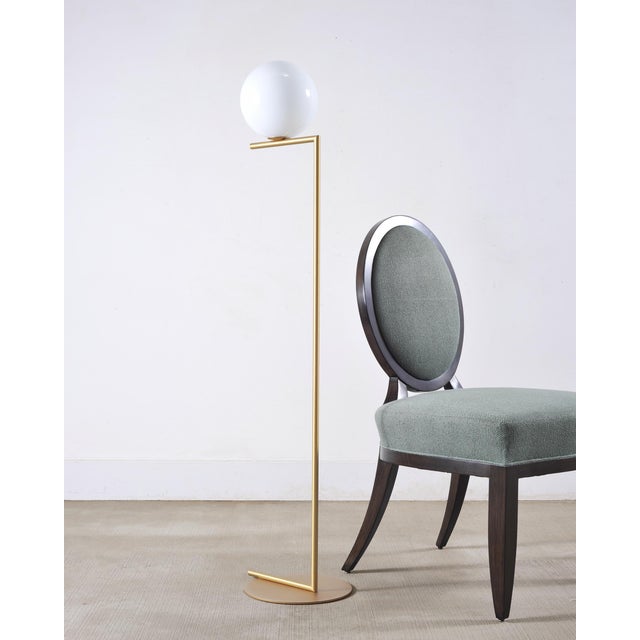A striking matched pair of F1 floor lamps from the IC Light Collection designed by Michael Anastassiades in 2014 for Flos....