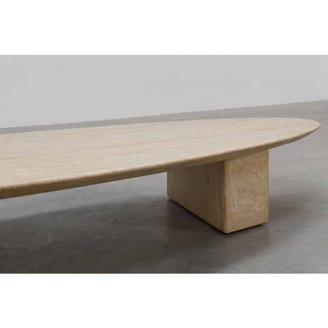 A sleek and sculptural design by Eichholtz, this 20th‑century coffee table captures the warm, organic elegance of...