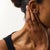 These elegant contemporary target stud earrings showcase two round brilliant cut diamonds totaling approximately 1.00...