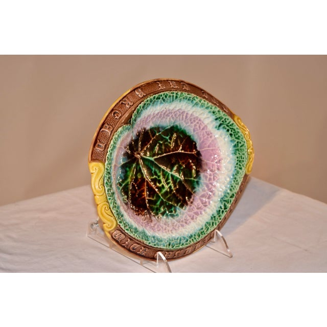 19th century Majolica bread tray in a lovely mold with a central leaf design in a multicolored palette of green, brown,...
