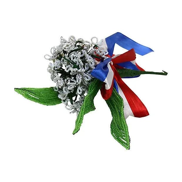 A dazzling bit of early 20th-century French craftsmanship, this hand-wired bouquet of glass seed bead flowers stuns in...