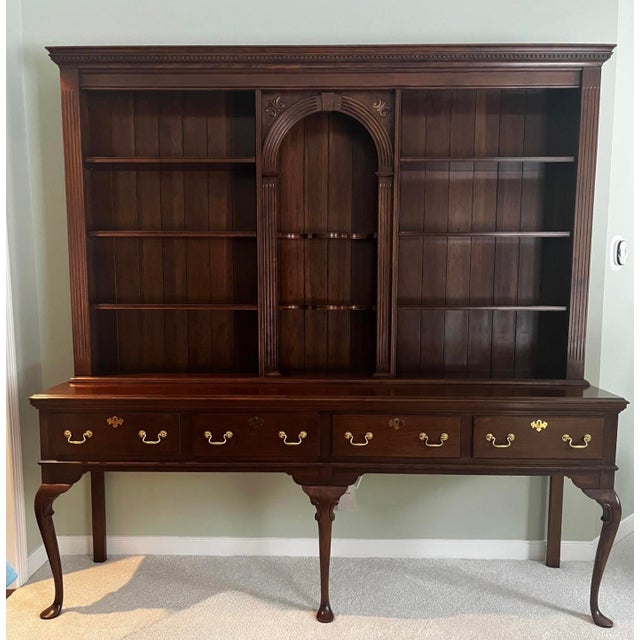 A stunning, two-piece traditional hutch and sideboard by the renowned Harden Furniture Company of McConnellsville, New...