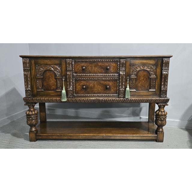 Outstanding Elizabethan style oak and burr walnut sideboard, with bulbous legs, oak plank undertier. double doors with two...