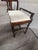 Antique boudoir bench of carved walnut. Manufactured in the 1920's by Crocker Chair Company in Sheboygan, Wisconsin. It...