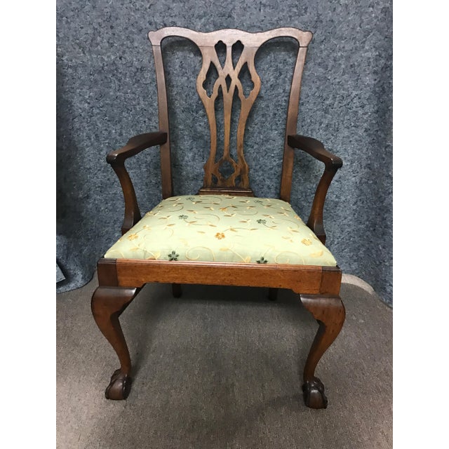 Graceful, mahogany, ball and claw foot Chipperdale-style chair which is in excellent shape, sturdy and newly recovered.