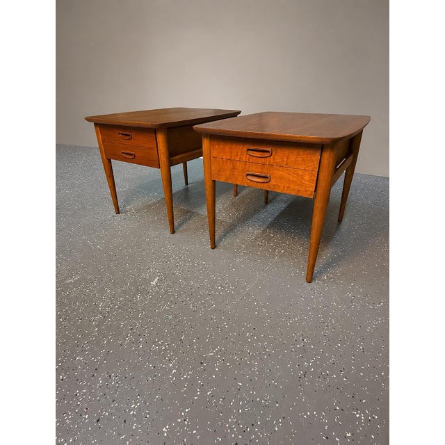 Beautiful, classic pair of Danish-modern inspired mid-century modern side tables by Lane Furniture. These tables highlight...
