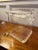Midcentury thick lucite ice bucket with solid cylinder handles, tongs and hinged lid. The bucket has a rounded square...