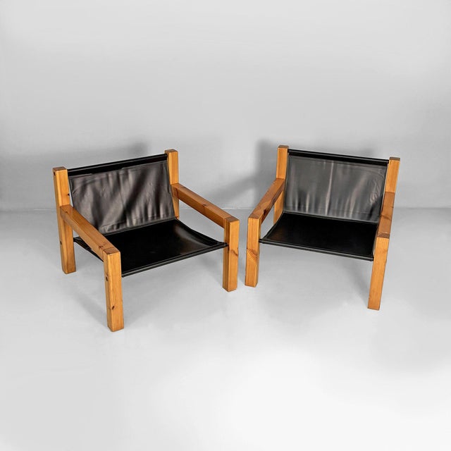 Italian modern leather and wooden armchairs by Silvano Passi, 1970s Pair of armchairs with a solid wood frame and a...
