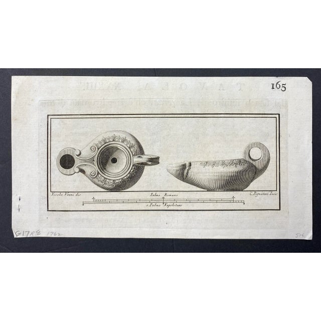 1762 copper plate engraving of the top and side of a Roman oil lamp.