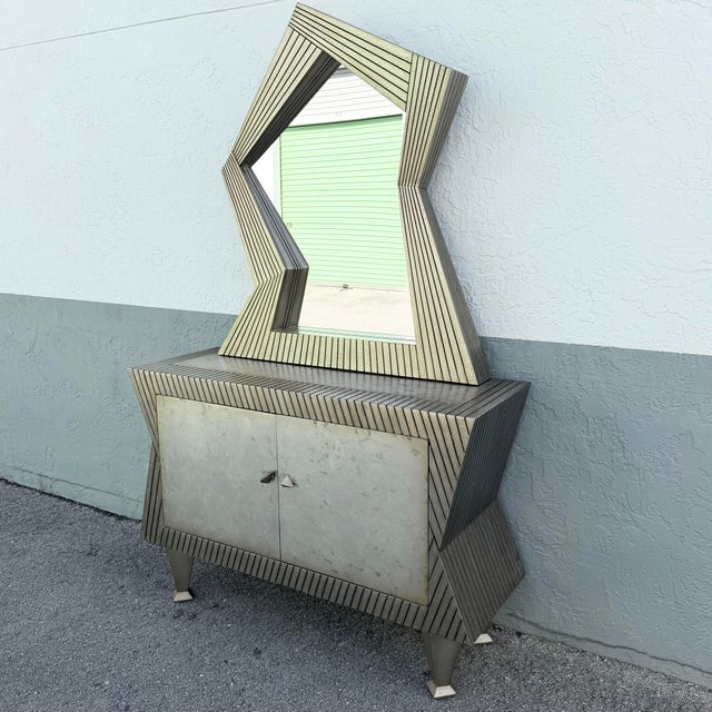 Mirror: 41”w, 5”d, 45.5”h A dramatic vintage credenza and mirror ensemble showcasing the bold geometry and artistic spirit...