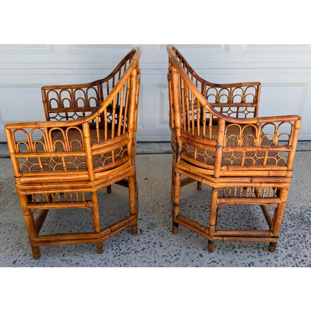 This exquisite pair of Brighton Pavilion-style armchairs with intricate bamboo fretwork, gracefully curved arms, and a...