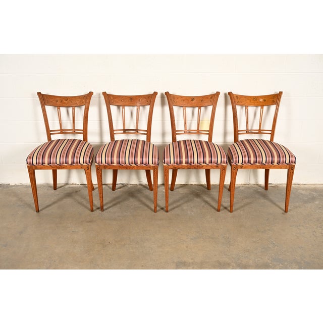 A gorgeous set of four antique Italian Regency or Neoclassical dining chairs Italy, Early 20th Century Fruitwood, with...