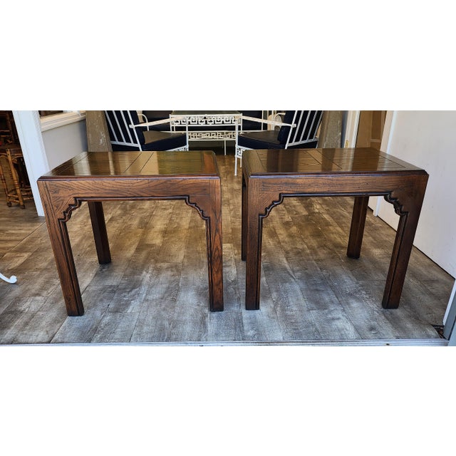 The Henredon Asian inspired side table in a dark walnut finish is a reimagined parsons table with a parquetry tabletop and...