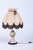 This decorative table lamp dates back to the 1960s and represents a striking example of Czechoslovak "Mid-Century"...
