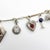 1920s Art Deco 14k Gold and Platinum Diamond and Gem Set Charm Bracelet For Sale - Image 4 of 12