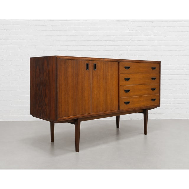 Mid Century Modern Rosewood Credenza, Made in Denmark, c. 1960’s. Beautifully proportioned and crafted in richly figured...