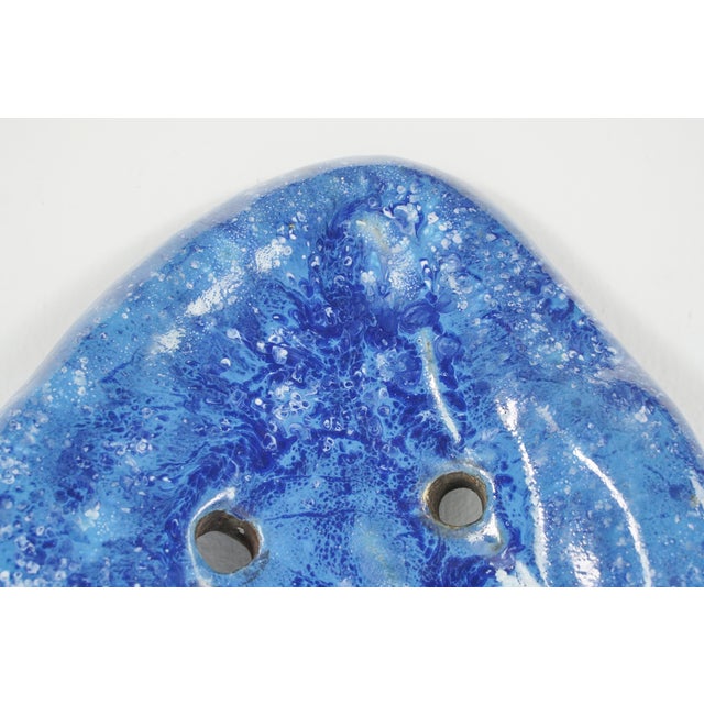 Vintage Atomic Era odd shaped door pull made of stone with a blue glaze finish. Good condition with some chips in the...