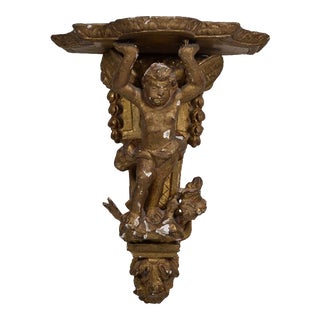 France XVIIIth Century Small Wall Bracket in Stuccoed and Gilded Wood, the Scalloped Top Supported by Zéphir For Sale
