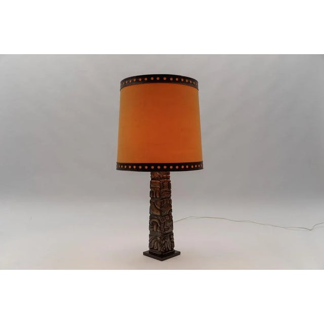 Hand carved in Honduras. he lamp base alone measures 54cm height. There is a European plug on it. This piece has an...