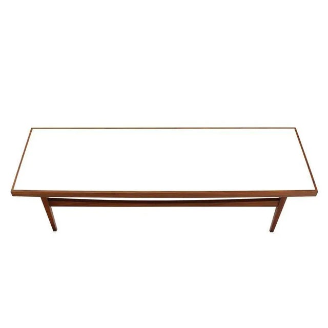 Very nice mid-century modern solid walnut rectangular coffee table. Made in the early 20th century.