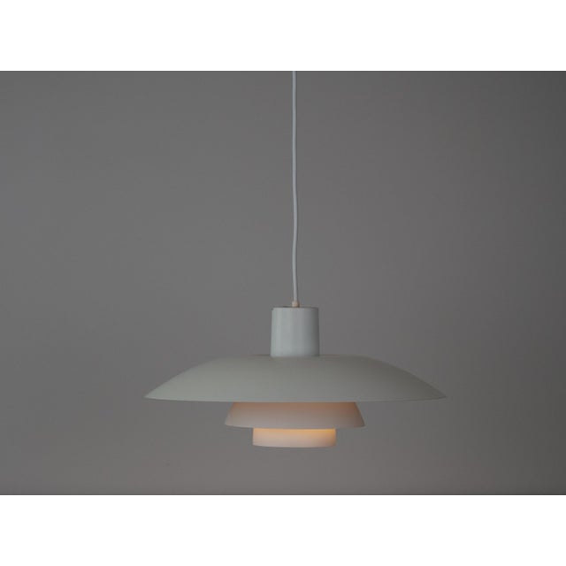 The ph 4/3 lamp is an absolute classic, designed by the renowned danish designer and architect poul henningsen. It has...