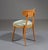 Set of four vintage dining chairs. Crafted from premium beech wood, these chairs boast a light, natural hue that adds...