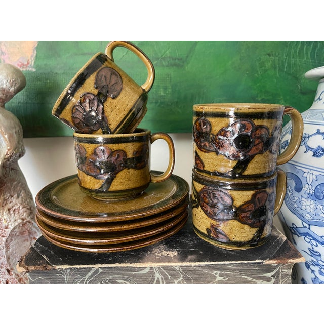 Wonderful vintage Japanese stoneware tea set, this listing includes four mugs with matching saucer, and the creamer and...