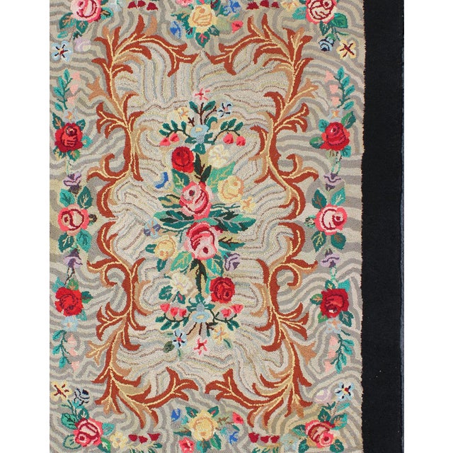 Measures: 4'7 x 6'6 Charcoal, Red, and Green Antique American Hooked Rug with Large Flower Design. Charcoal, red, and...