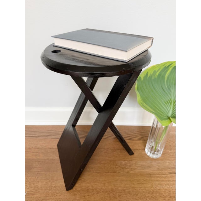 Sculptural black folding stool attributed to Adrian Reed’s iconic “Suzy” design for Princes Design Works, originally...