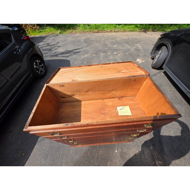An early American lift-top blanket chest with drawers, crafted circa 1790–1810, likely in Connecticut. The piece features...