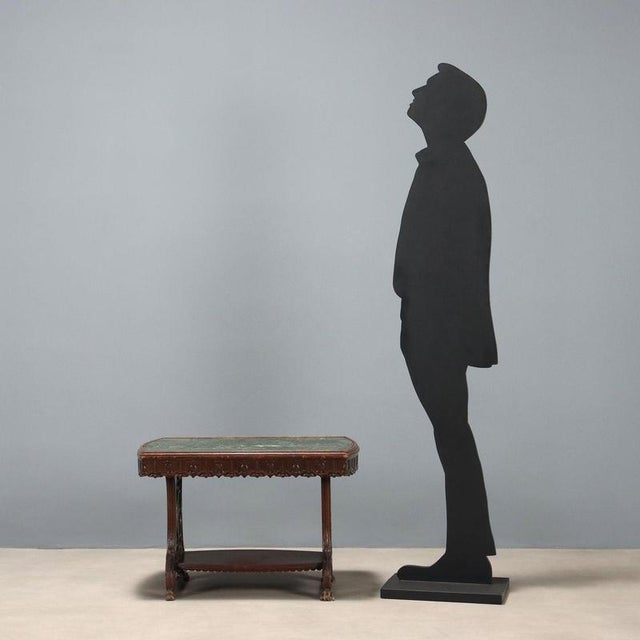 Walnut coffee table. Green Alpine marble top, carved floral band underneath, lyre-shaped legs with openwork and carved...