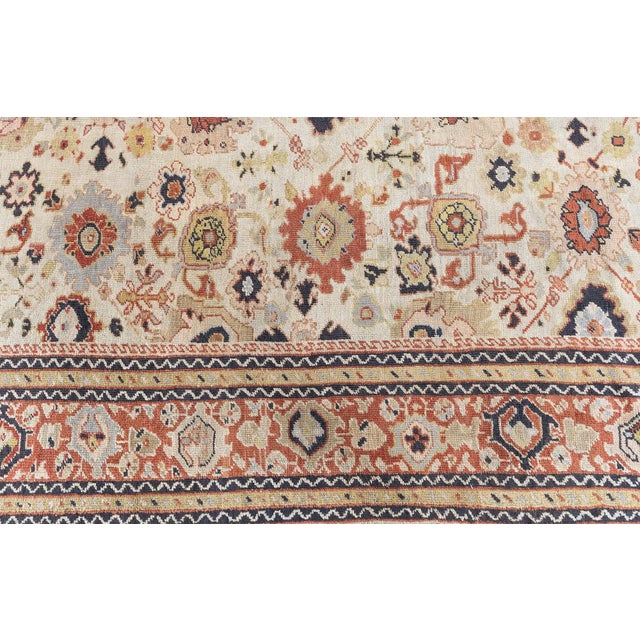 A late 19th century Persian carpet for sale from Sultanabad having a beige field with a classical allover trellis of...
