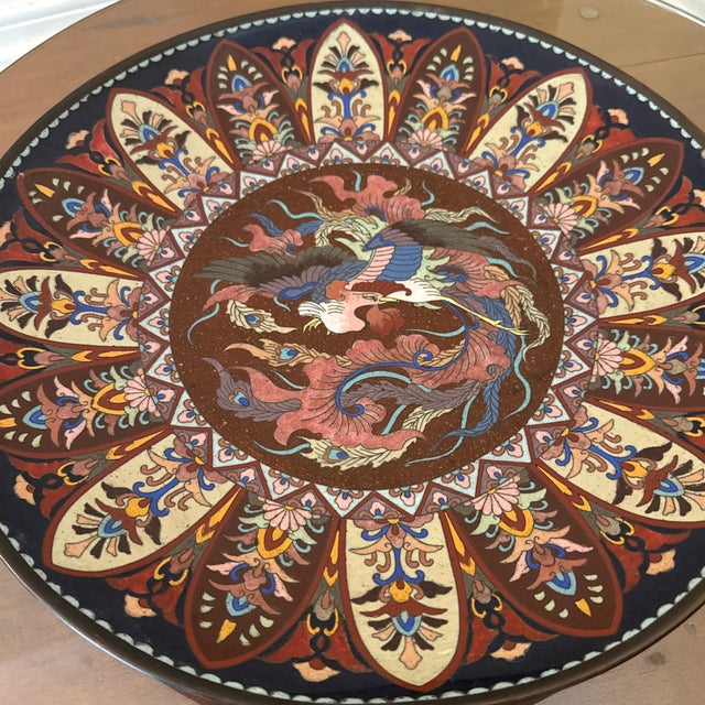 nice Japanese cloisonne charger. This charger has phoenix decoration in central circle with some goldstone accents and...
