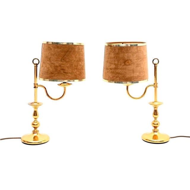 A stylish and very well made pair of vintage brass table lamps with velvet shades. They were made in England, and date...