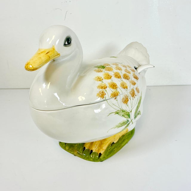 This is a delightful hand-painted Italian ceramic Duck Soup Tureen. It’s a large tureen and features a Duck in the Trompe...