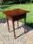 Offered is an antique Sheraton style one drawer stand. It is early 19th century with a poplar top and cherry base. The...