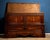 An elegant early 19th-century Emilian sideboard, made of fine cherry wood and enriched with refined decorative inlays. The...