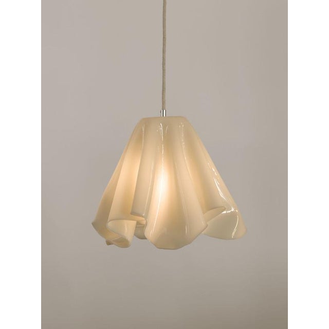Serenity pendant lamp in neutral beige bio-based resin by waves.studio dimensions: ø 35 x h 35 cm. Materials: bio-based...