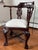 This exquisite Chippendale-style corner chair is crafted from solid mahogany, featuring a rich, dark-stained finish that...