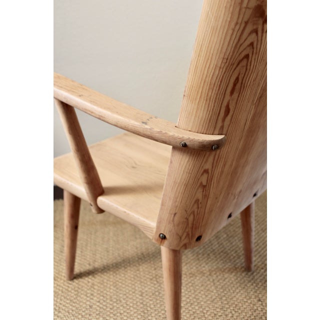 A beautiful set of a near pair of Swedish pine armchairs, consisting of one early Göran Malmvall example and one Svensk...