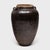 This large stoneware vessel is a Qing-dynasty (1644-1911) wine jar, originally filled with wine and spirits made from rice...
