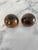 Sculpture accents for your dining table, these spherical hardwood salt and pepper shakers are crafted of walnut with a...