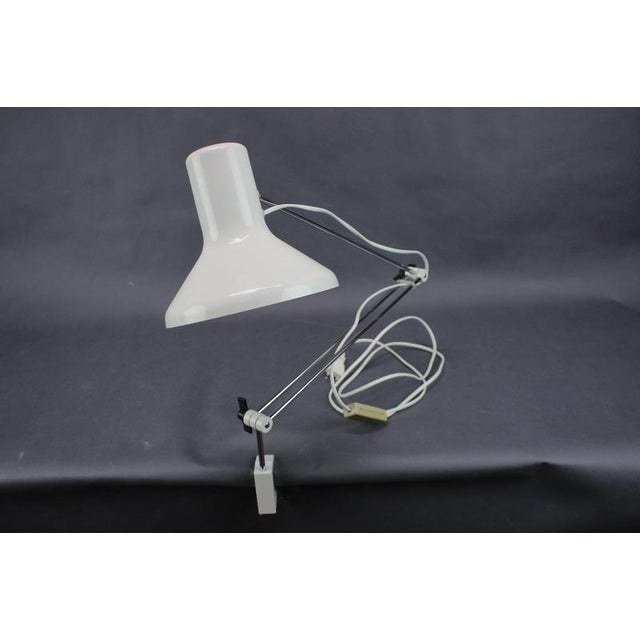 Elegant and highly functional 1970s czechoslovakian clip-on task lamp by napako, attributed to hurka. The lamp features a...