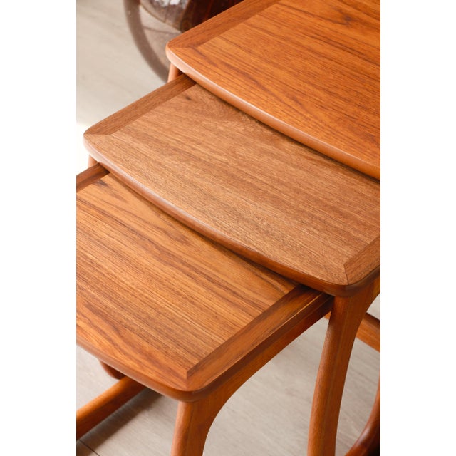 Add a touch of character to your home with this set of vintage teak nesting tables, a classic of 1960s design. Made by the...