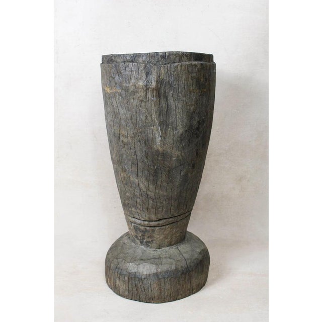 African grain stompers are made when they hollow out tree trucks and large branches to create these which are then used to...