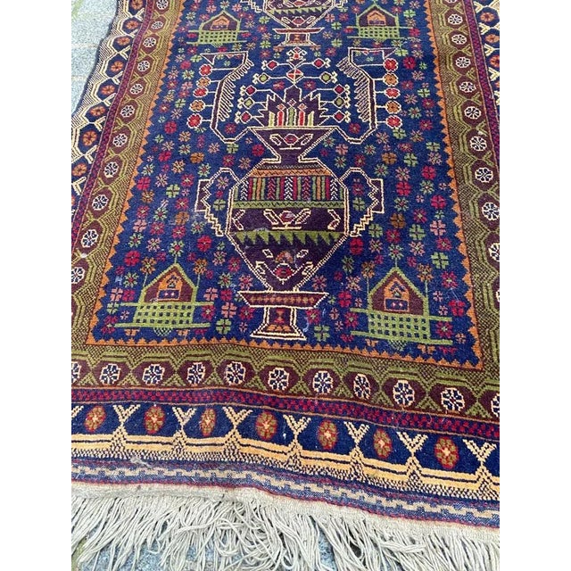 Beautiful mid-century Turkmen Baluch Afghan rug with beautiful tribal design and nice colors, entirely hand knotted with...