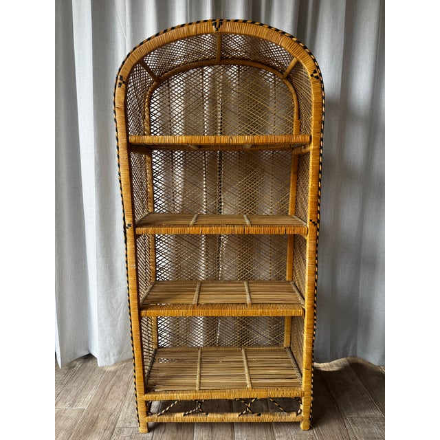 Solid wicker with rattan accent. Four shelves at different heights. 11-12 inches height in between shelves